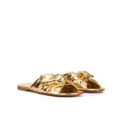 Quetty Sandalias planas doradas con detalle de lazo